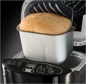 A close-up of the bread maker and its pan.