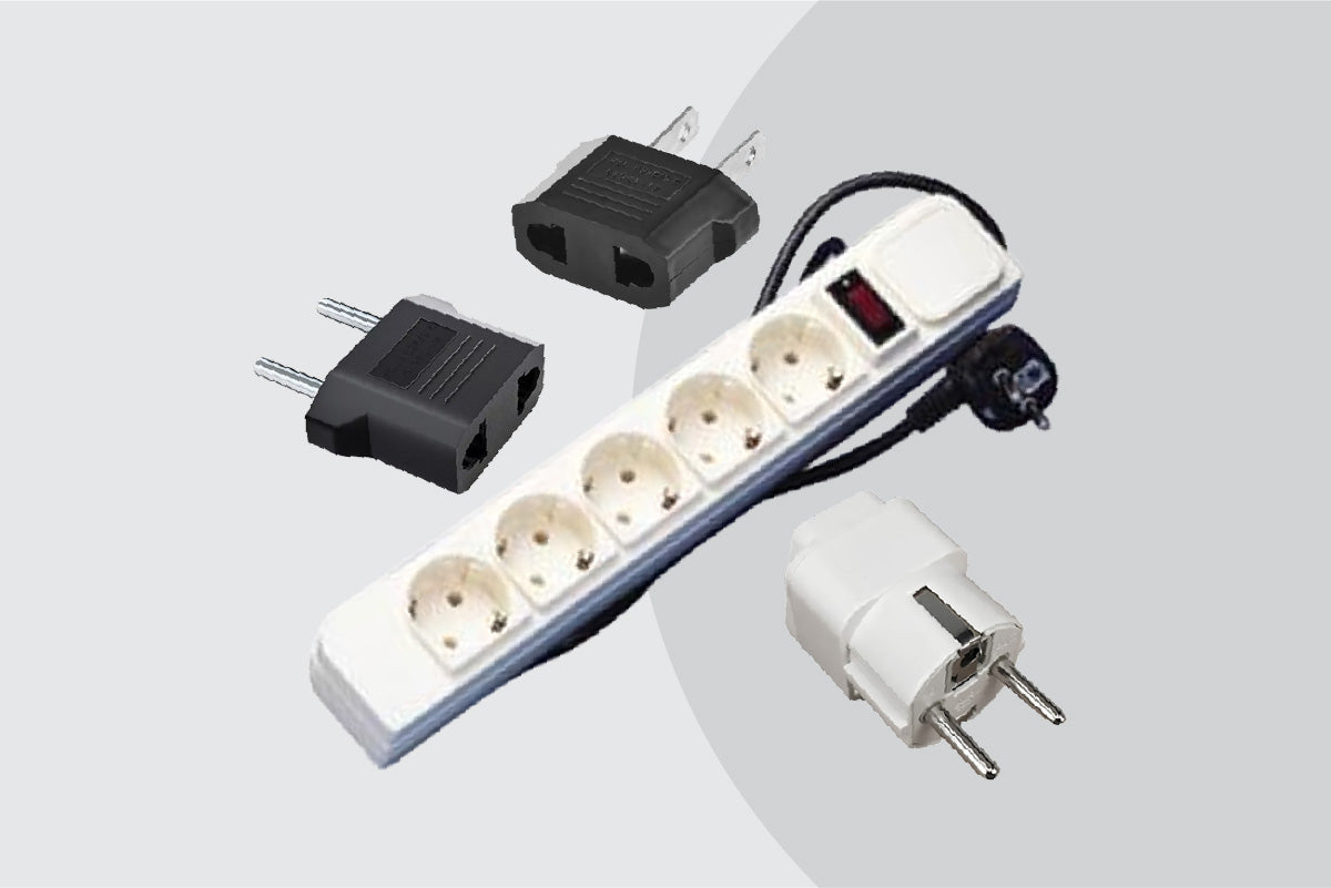 Set of electrical plugs and sockets on a light gray background