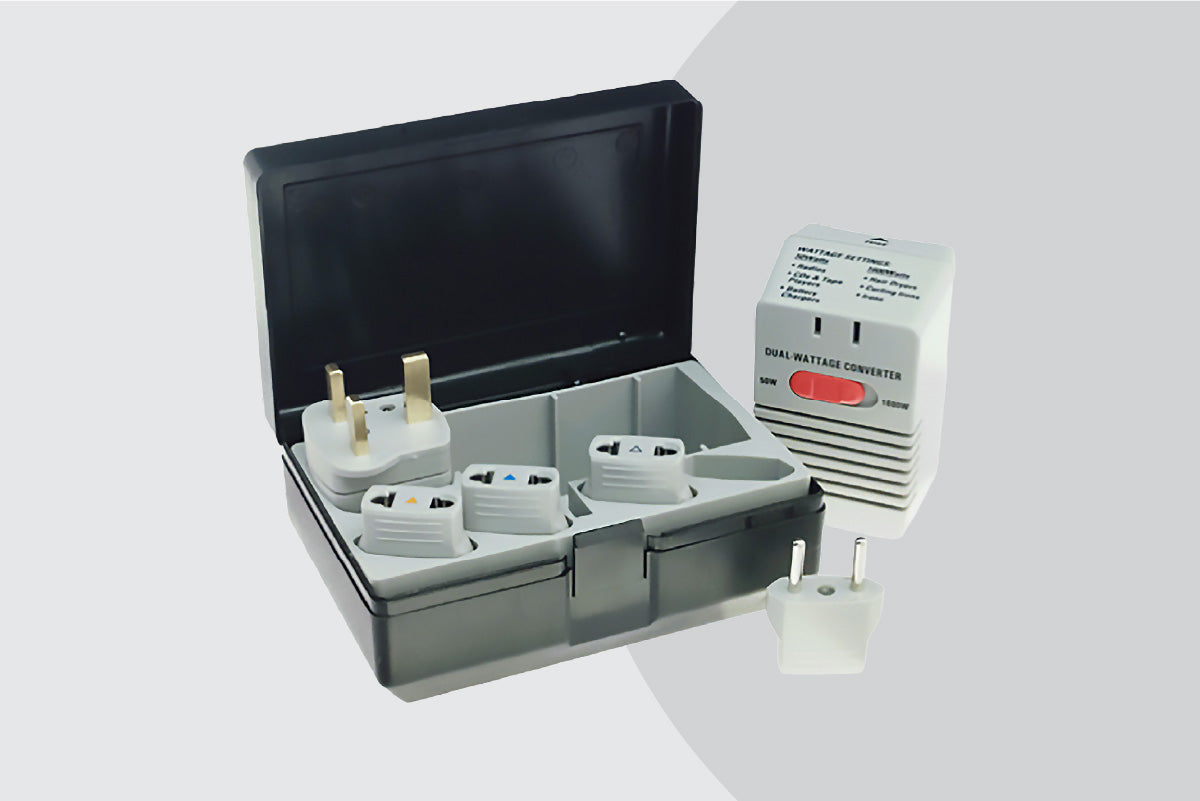 Set of travel adapters with a carrying case on a white background