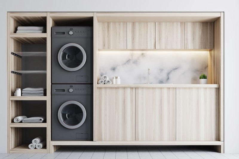 Modern kitchen with washing machine integrated into wooden cabinet